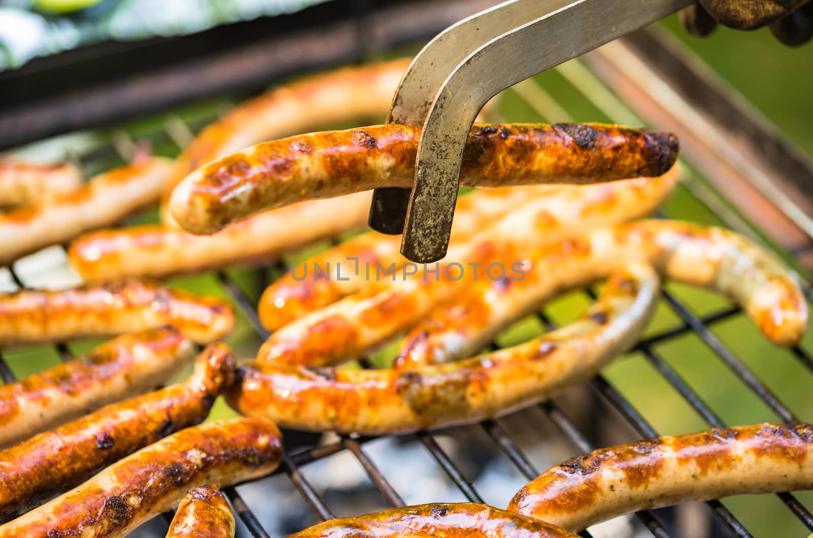 Close-up of grilled sausages on barbecue grill