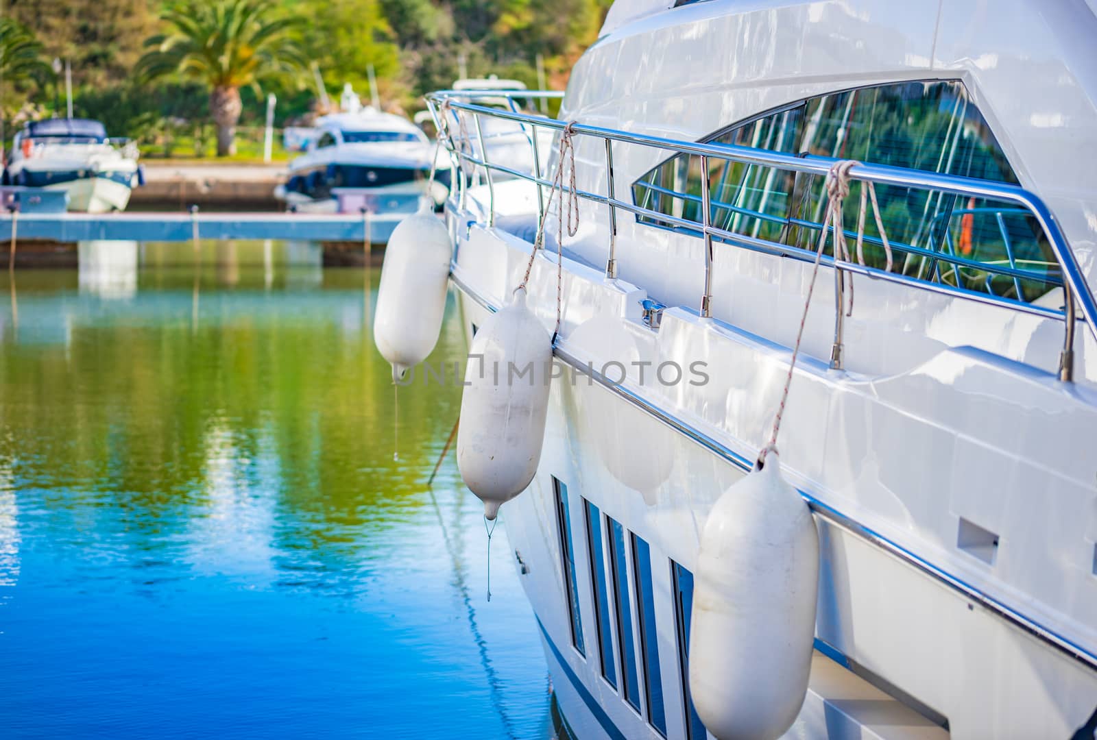 Luxury motor boat anchoring at harbor
