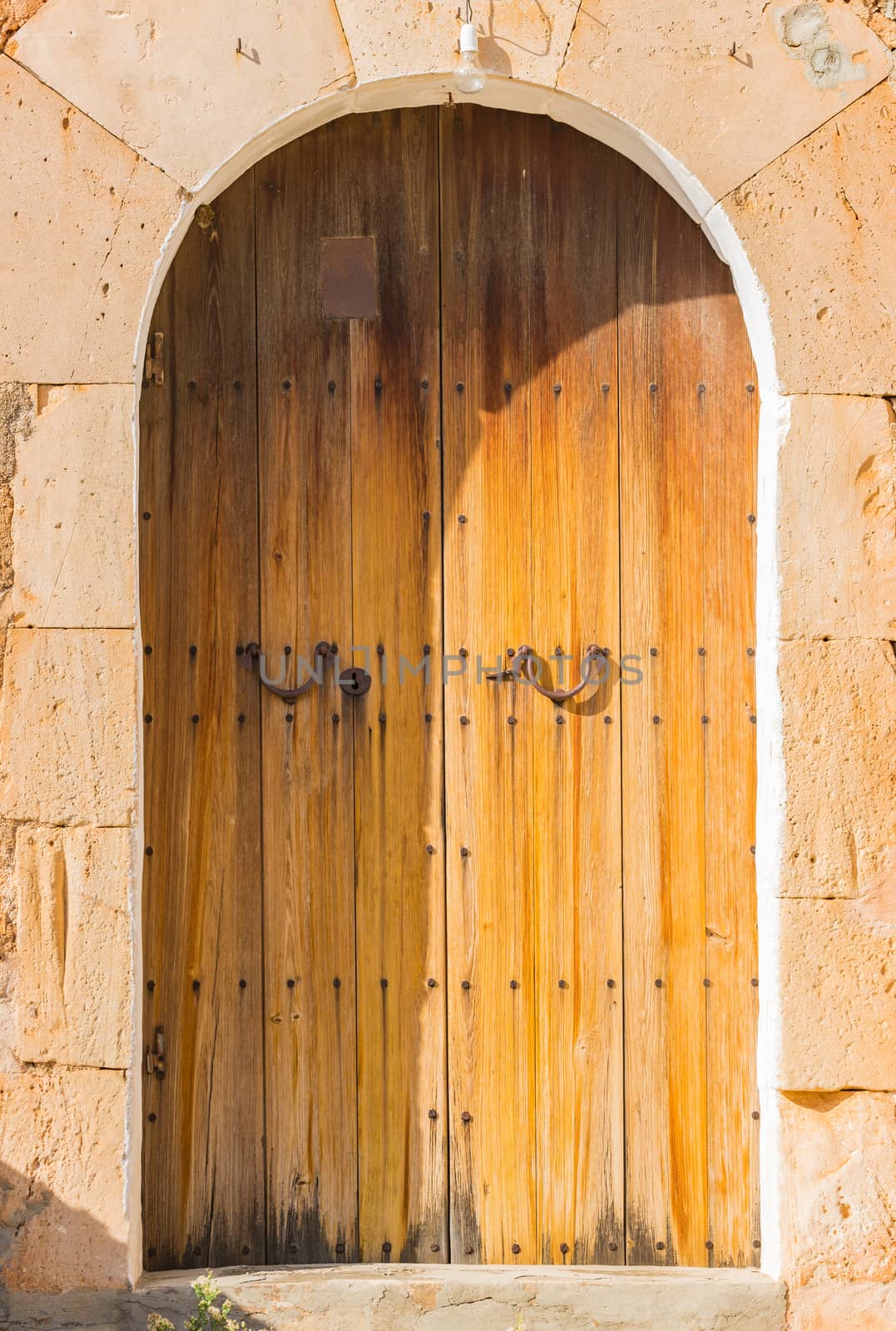 Close-up of old wooden front door residence entrance