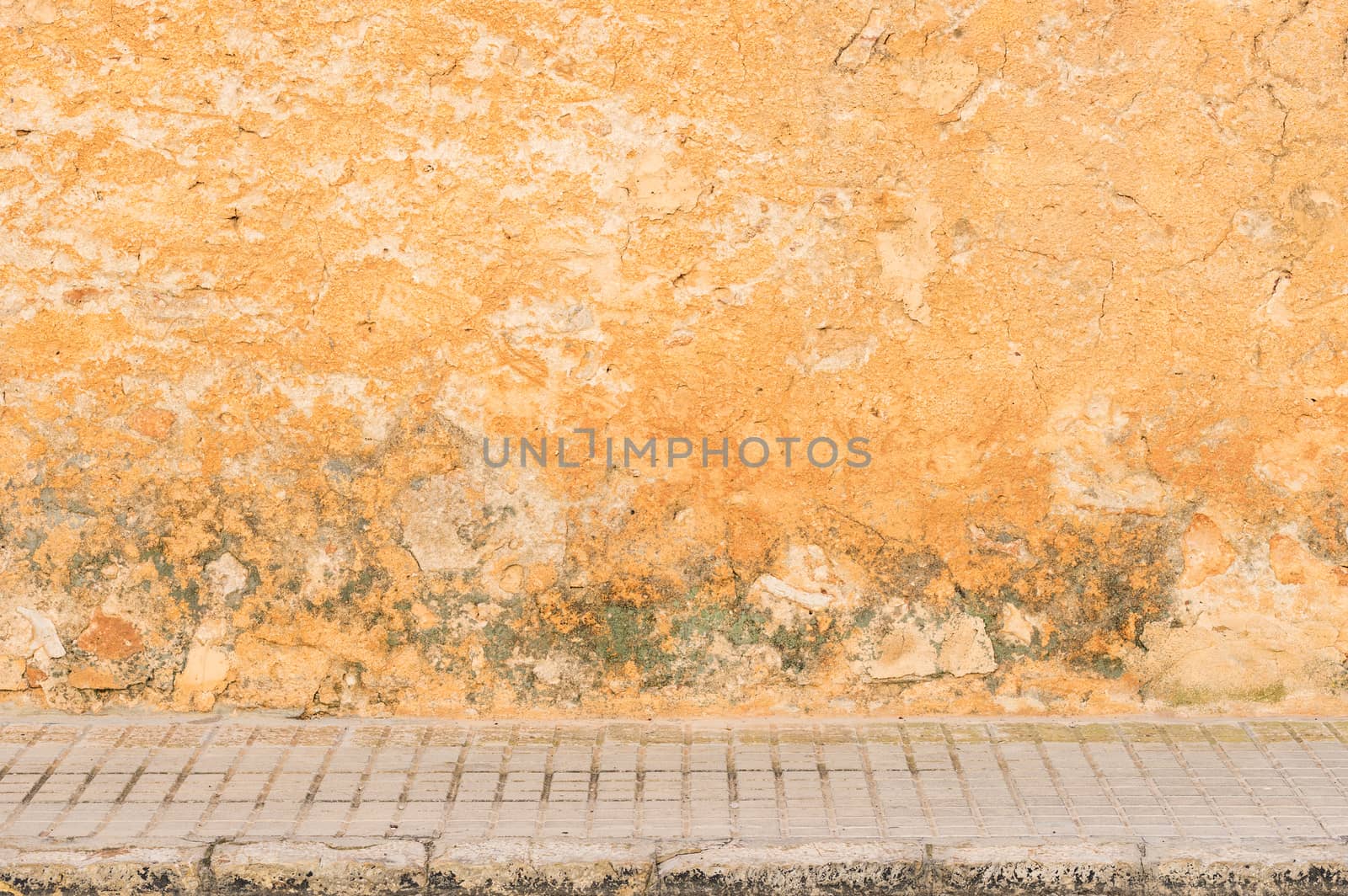 Grunge wall background texture with pavement and copy space