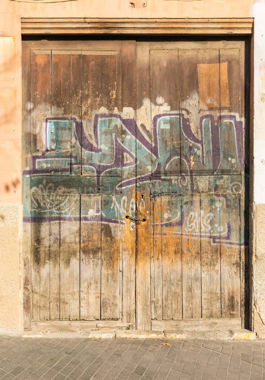 View of old graffiti paint on wooden door
