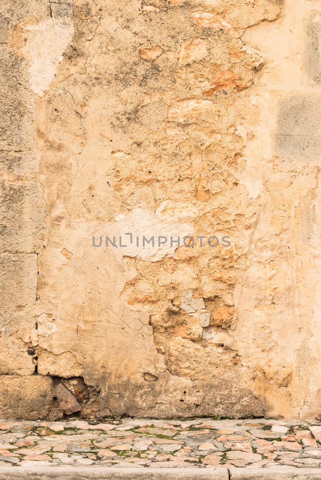 Vintage dirty wall background texture with pavement and copy space