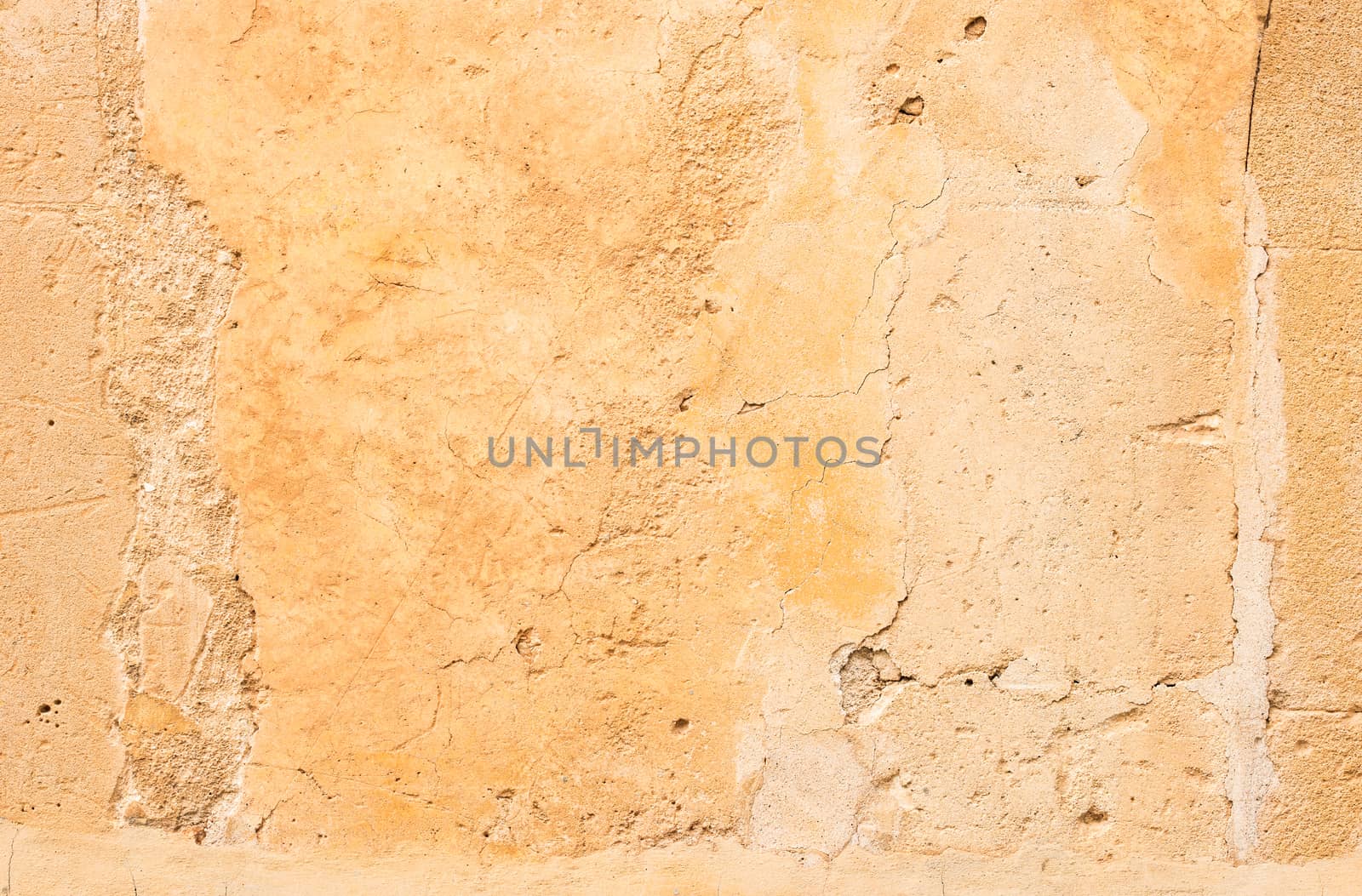 Vintage colored wall background with rustic weathered plaster texture 