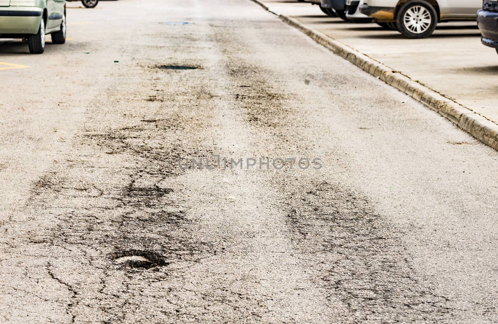 View of pot hole on asphalt road