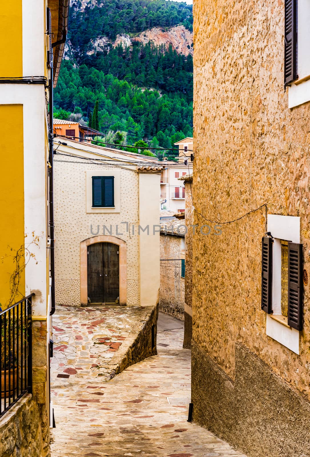 Idyllic old mediterranean village with narrow alley way 