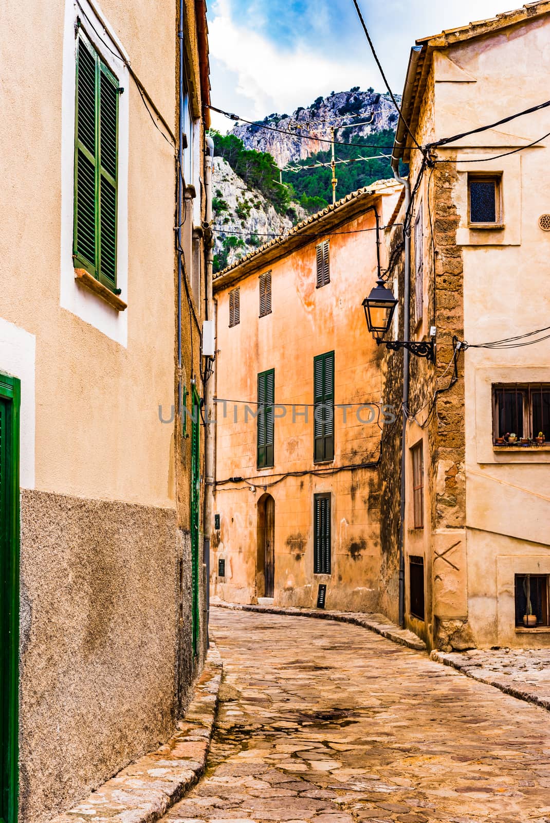 

Idyllic old mediterranean village with narrow alley way  by Vulcano