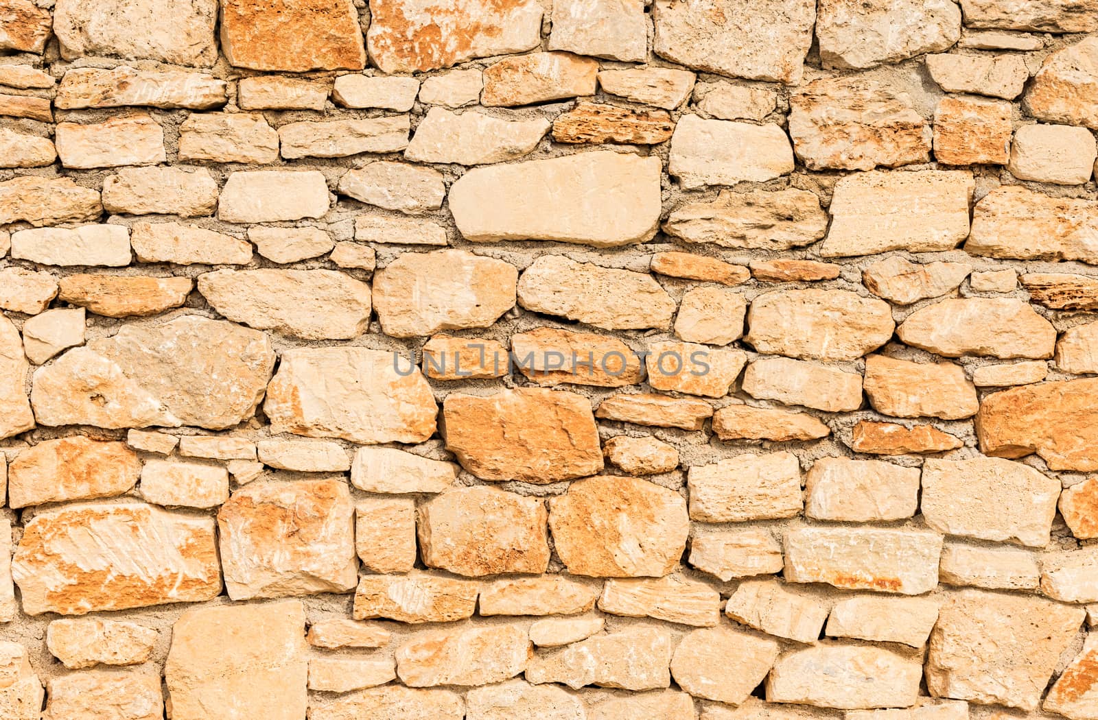 Rustic old stone wall background texture, structure close-up