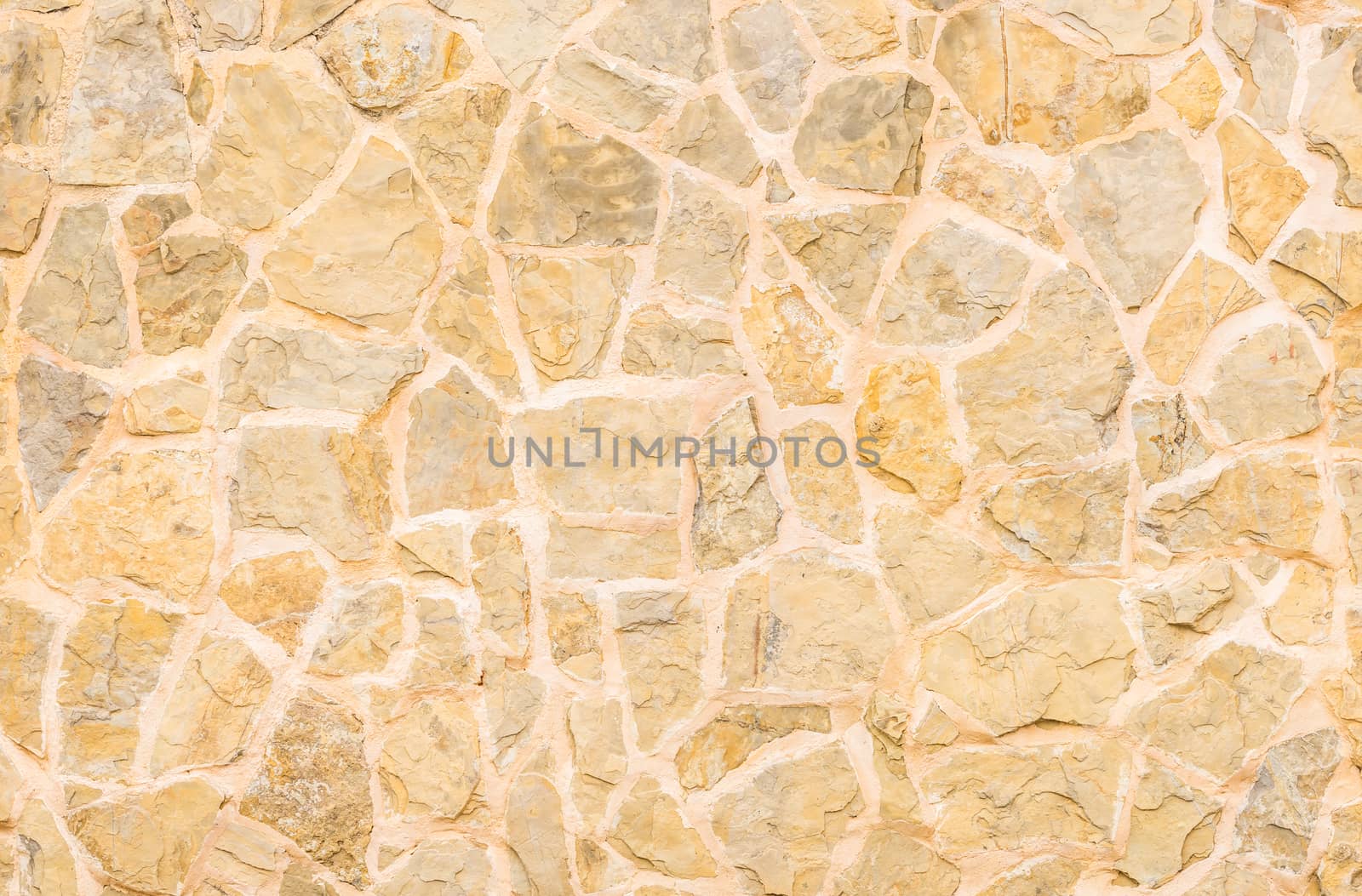 Pattern of natural stone wall background texture, close-up