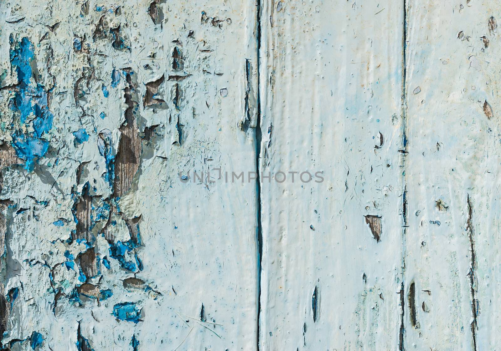 Vintage blue wood background texture with peeling paint