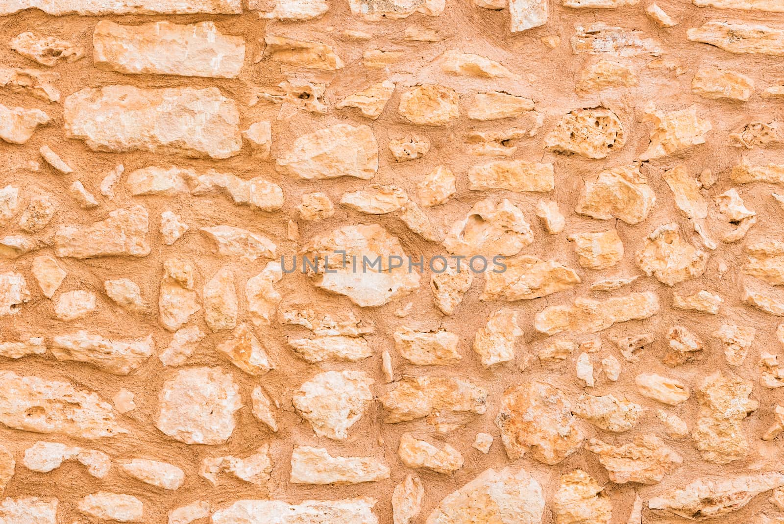 Vintage brown stone wall background texture, close-up