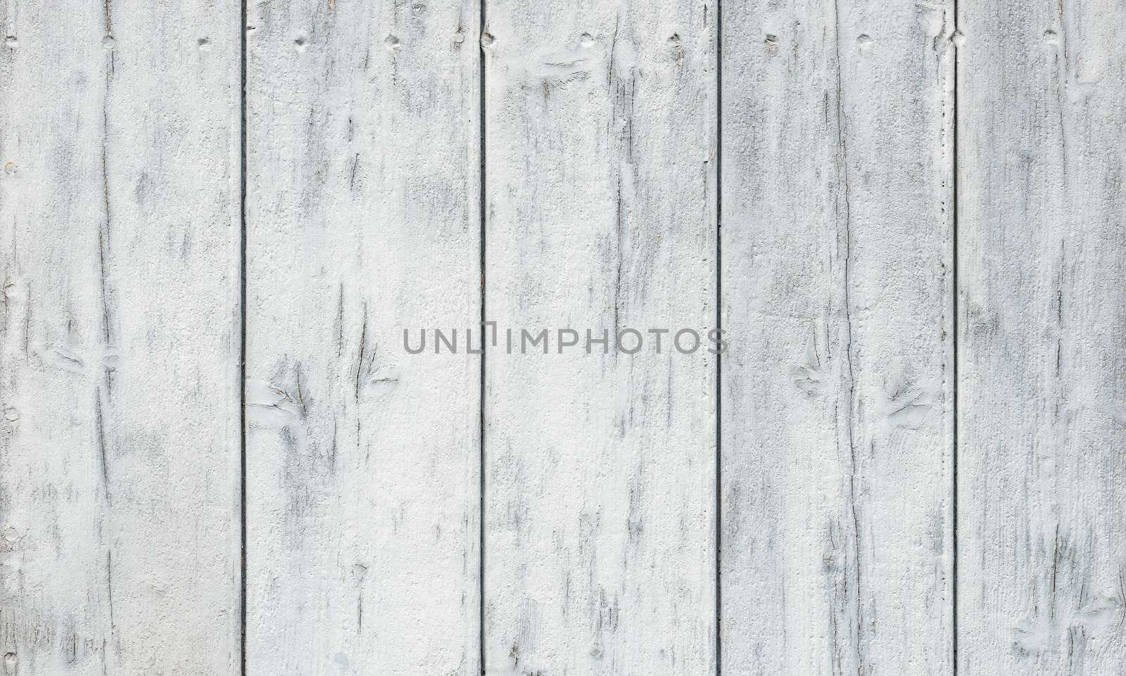 Old white painted wooden wall for background texture