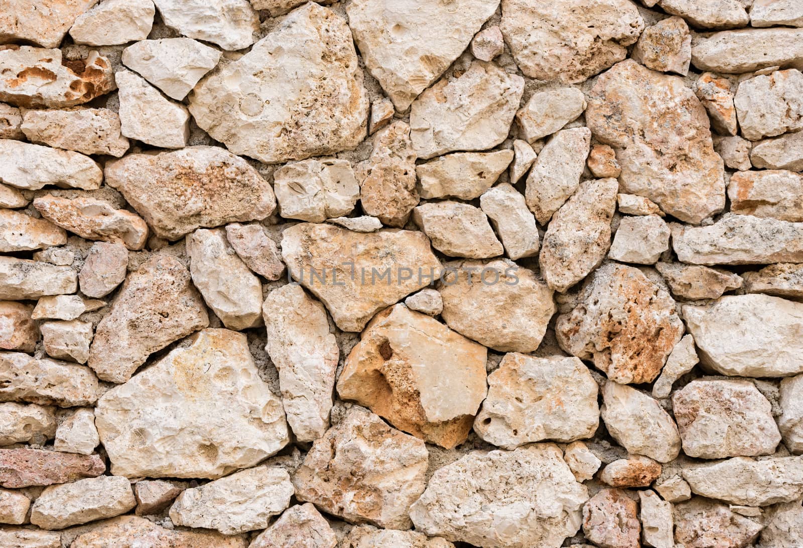 Old stone wall background texture, close-up