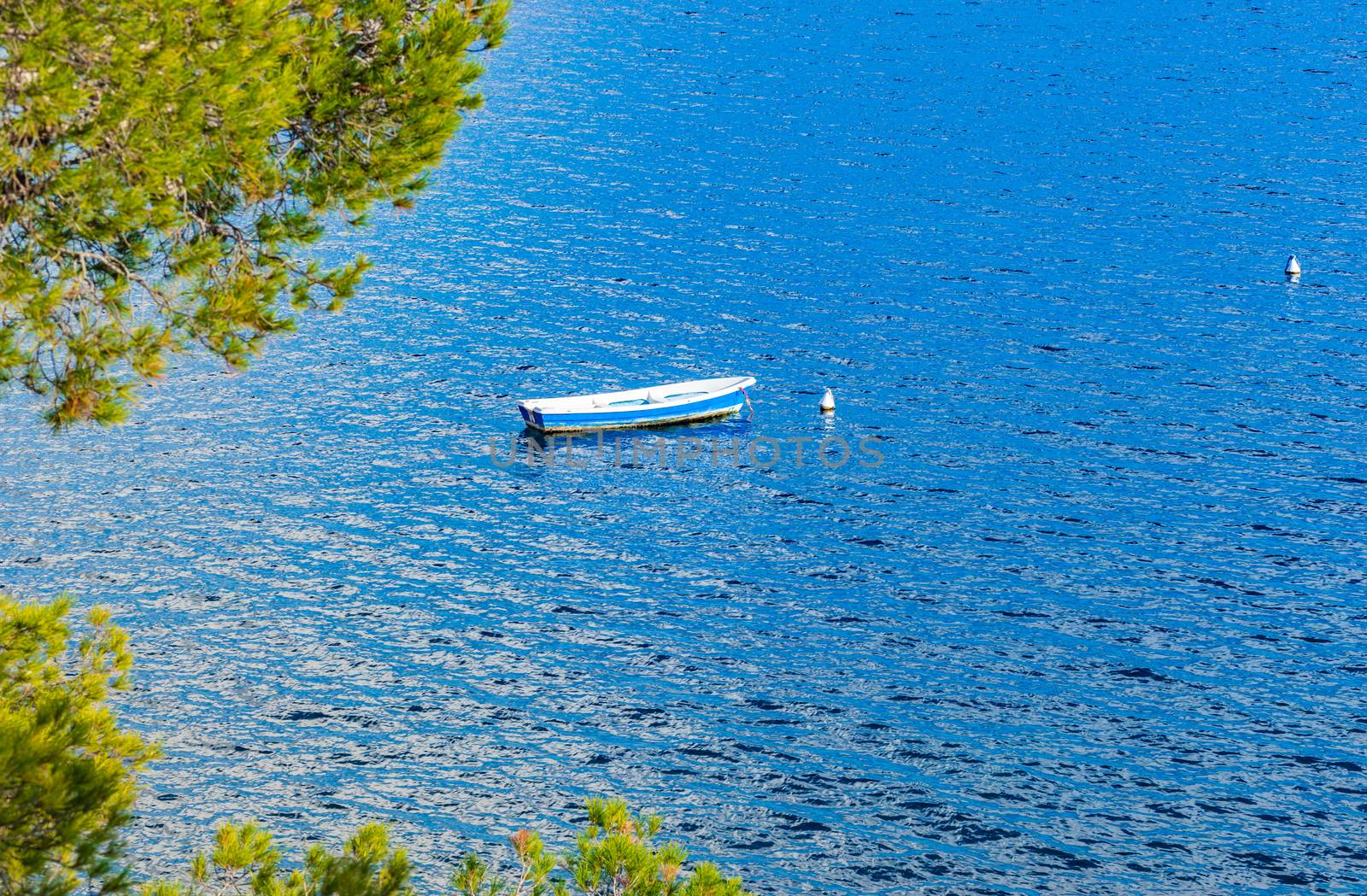Romantic view of an old fishing boat moored at the sea