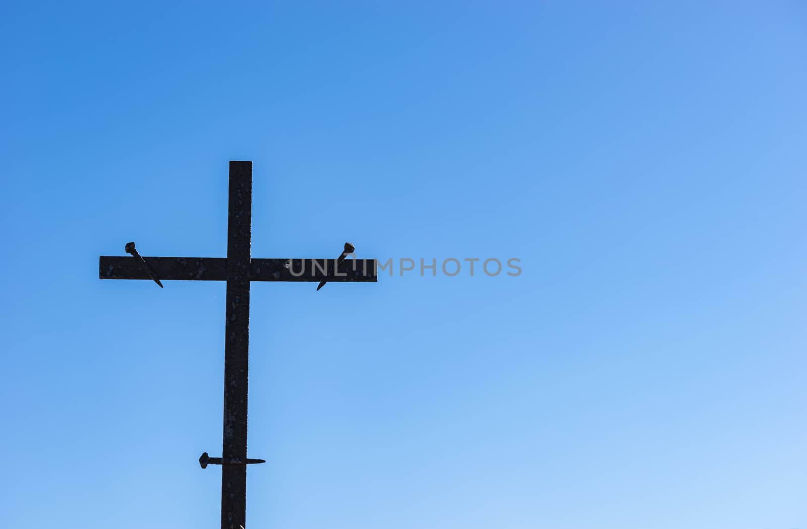 Cross against blue sky, religion christianity concepts background
