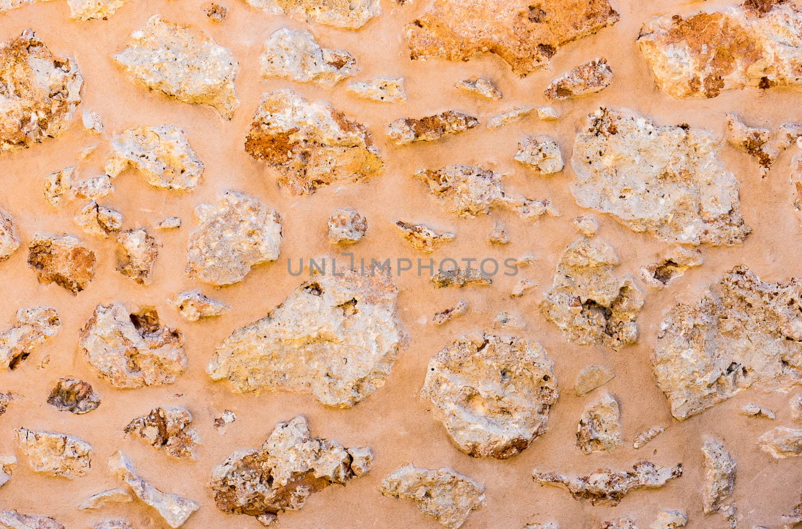 Natural old stone wall background texture, close-up