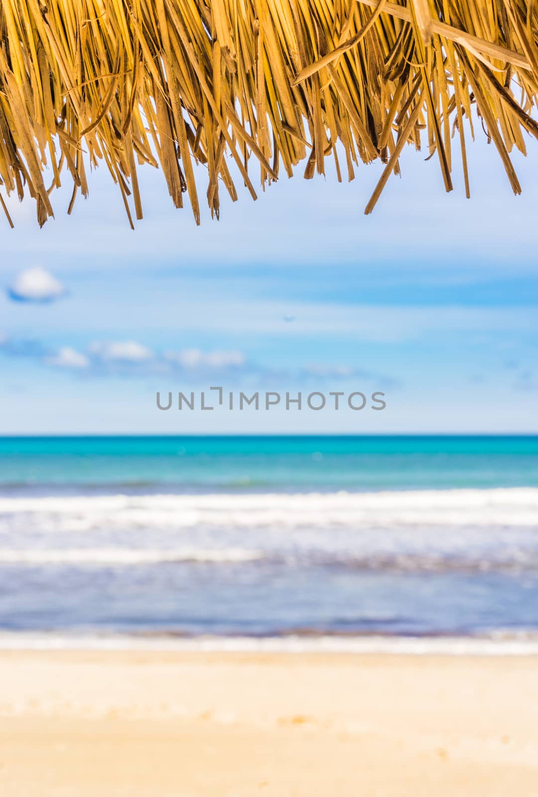 Sand beach sea summer holiday background with beach umbrella and sea view