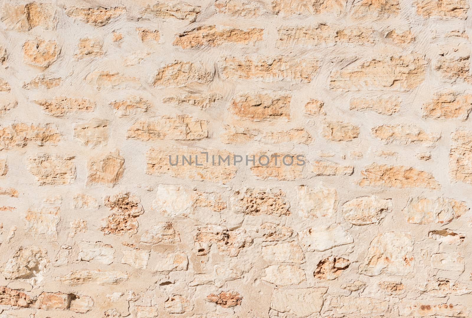 Rustic old stone wall texture background structure