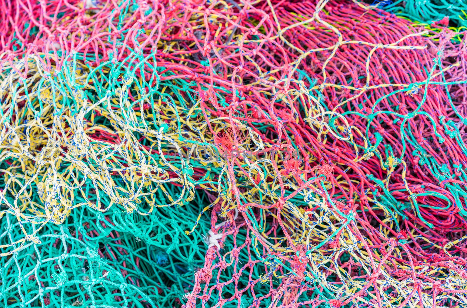 Close-up of colorful fish net pattern, maritime background texture
