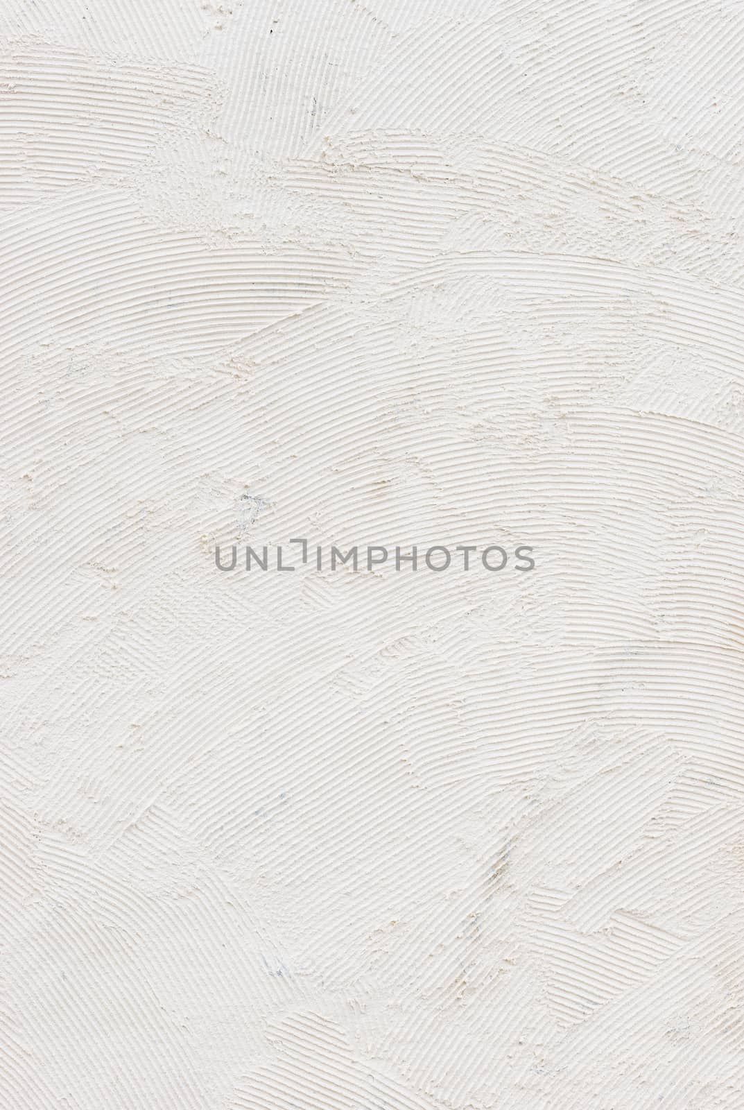 White raw plastered wall background texture with copy space