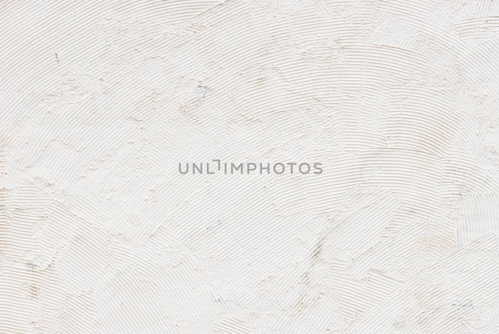 White raw plastered wall background texture with copy space