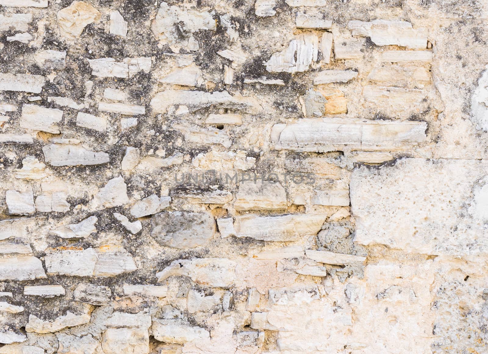 Grunge old stone wall backdrop texture, close-up