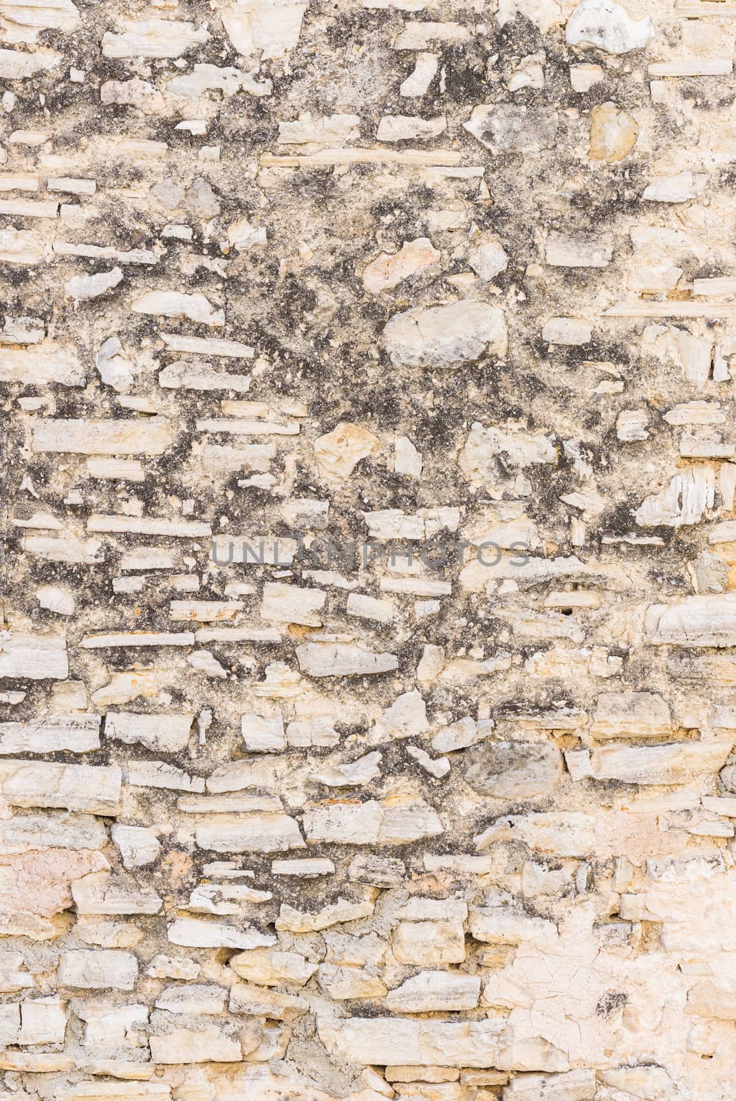 Vintage gray stone wall backdrop texture, close-up