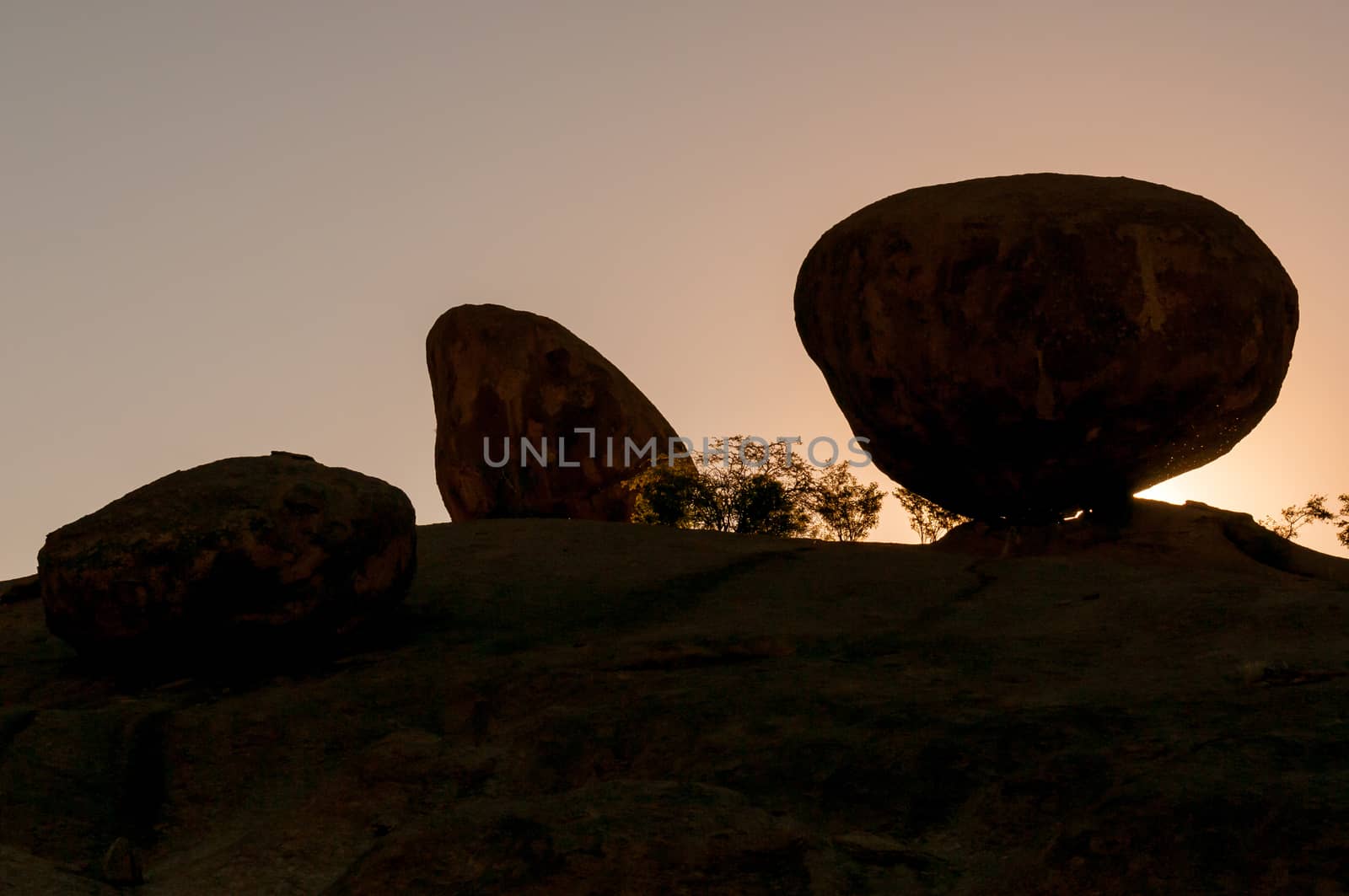 Silhouette of solid granite boulders at sunrise at Ameib in the Erongo Region of Namibia