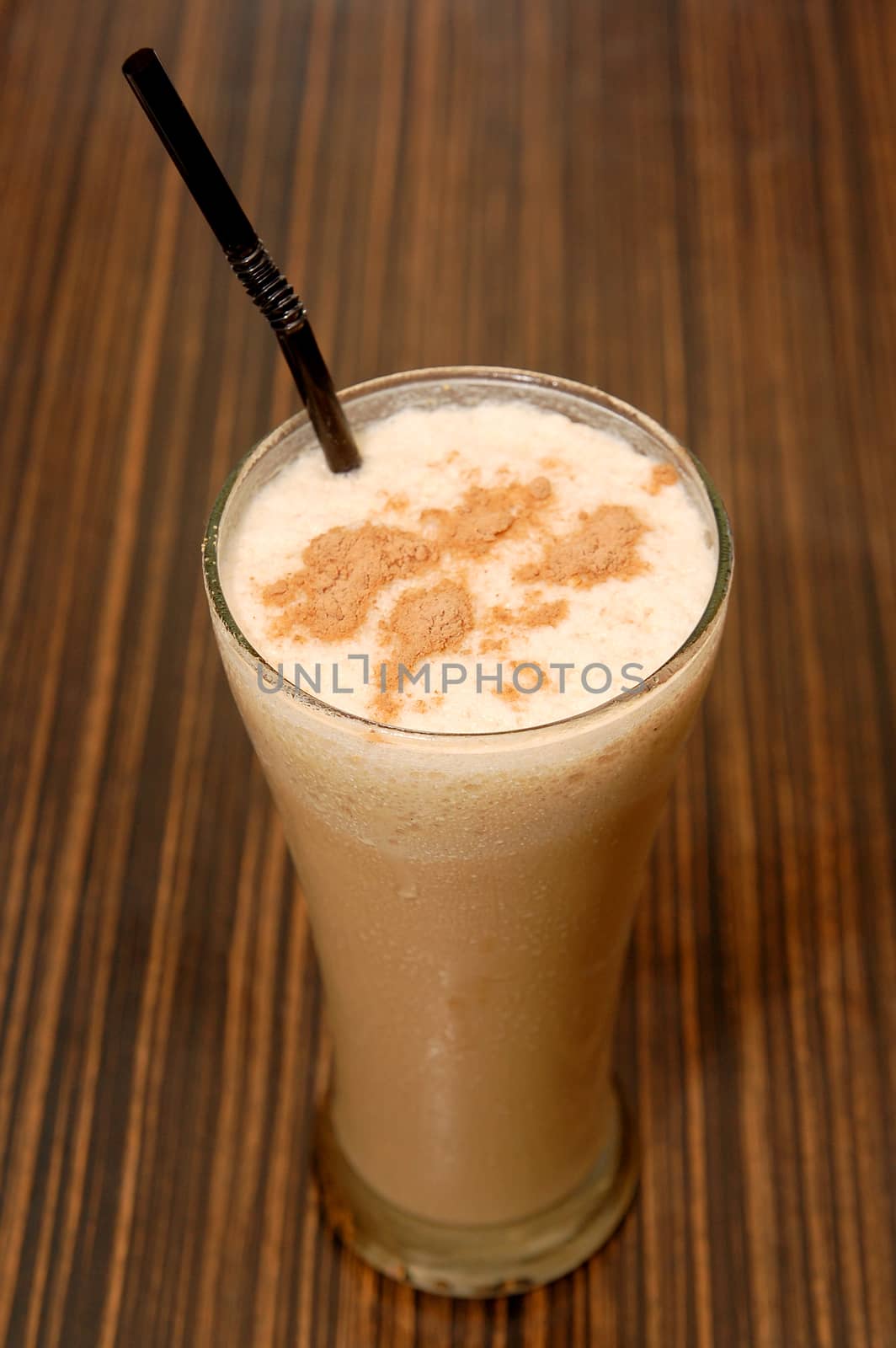 Coffee shake drink on glass with straw by imwaltersy