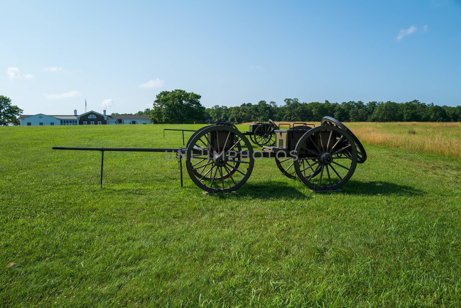 A wide angle photo of a caisson in the field at Battlefield National Park in Manassas, the site of the Battle of Bull Run.