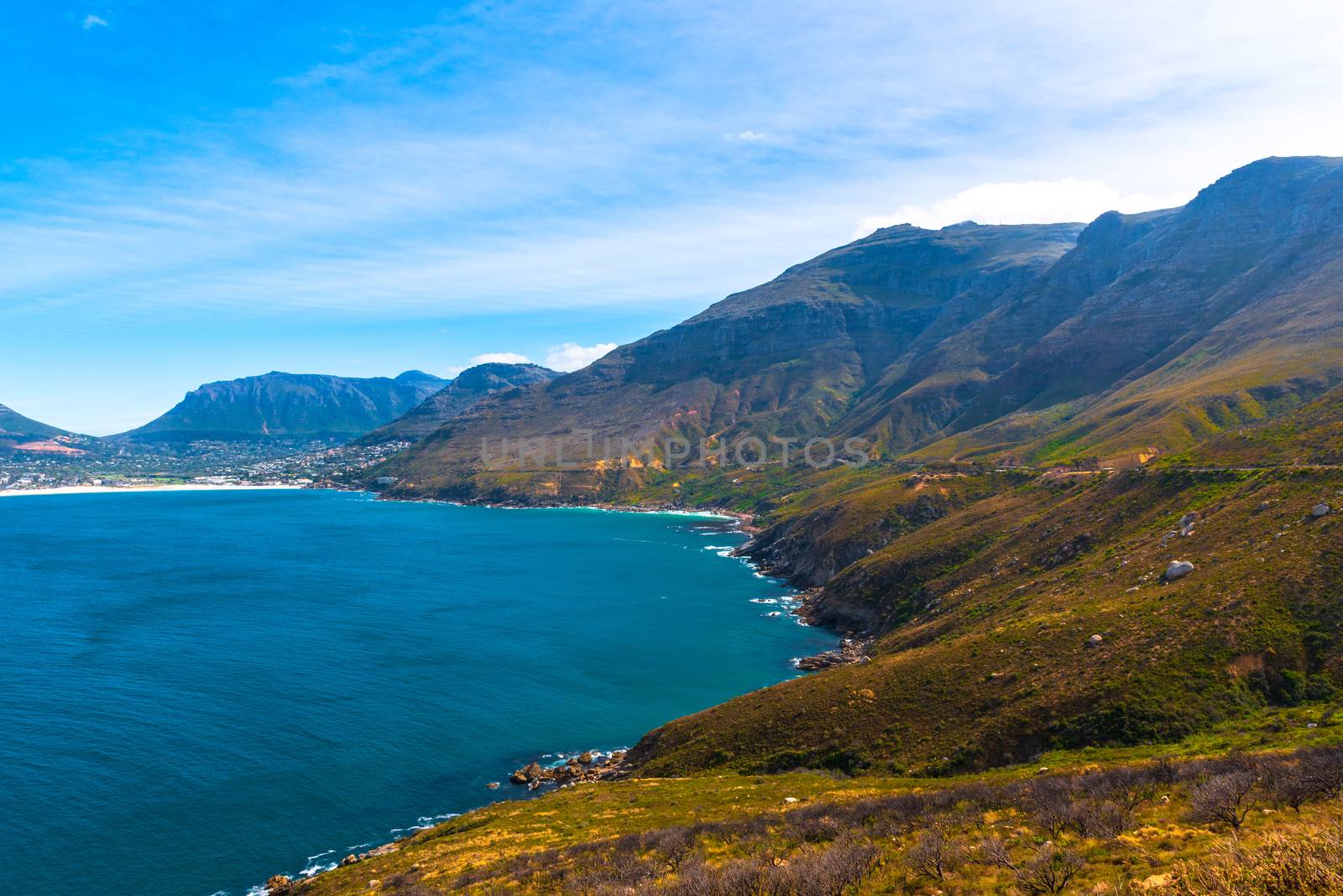 A shot looking down at the South African coast, with a blue sky in ythe background