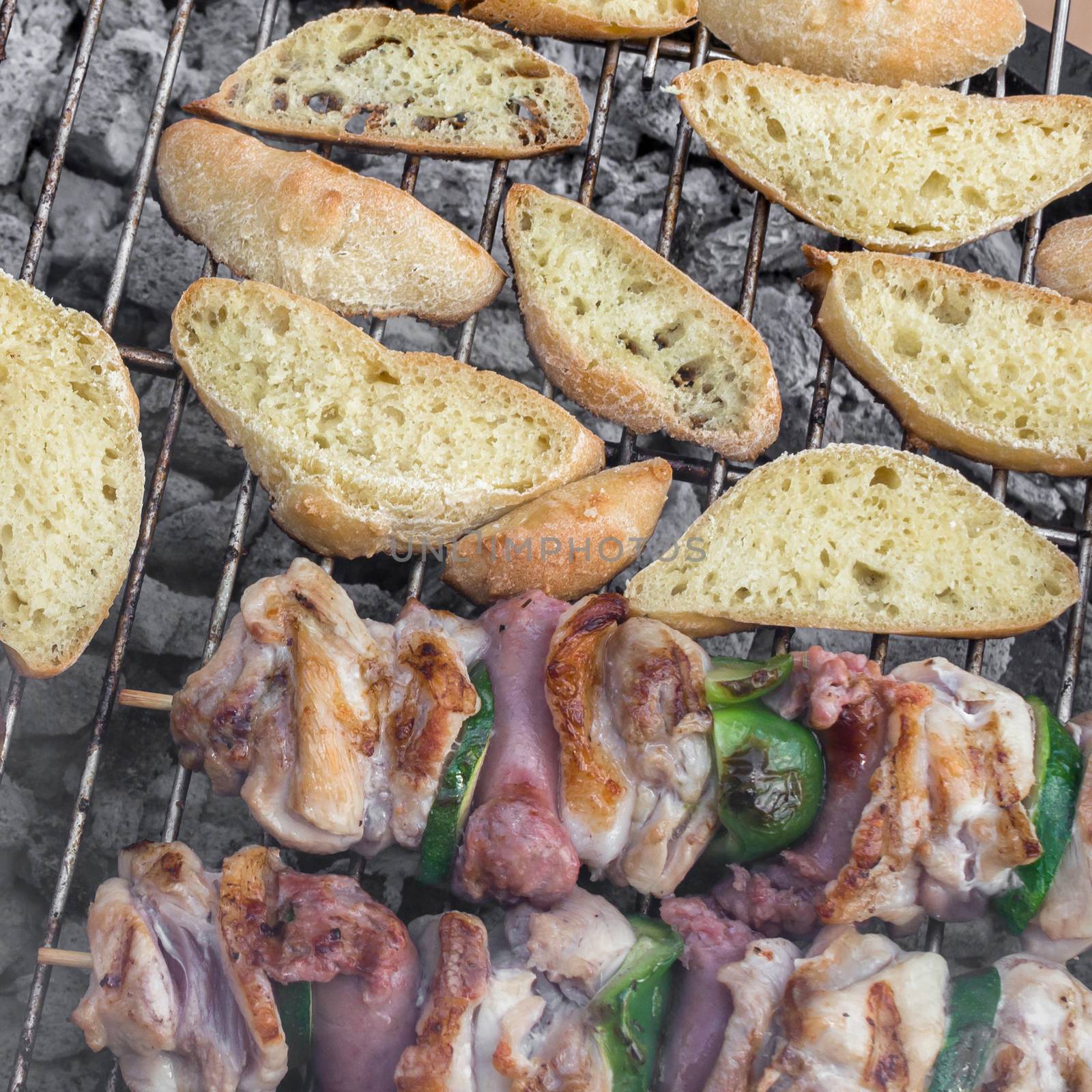 Bar-B-Q or BBQ with kebab cooking. Coal grill of chicken meat skewers with slices bread. Barbecuing lunch. Top view.