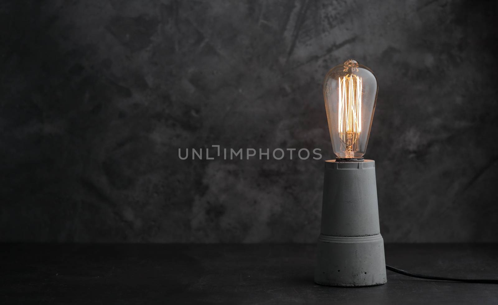 Retro lamp with Edison lamp on concrete. A good idea by selinsmo