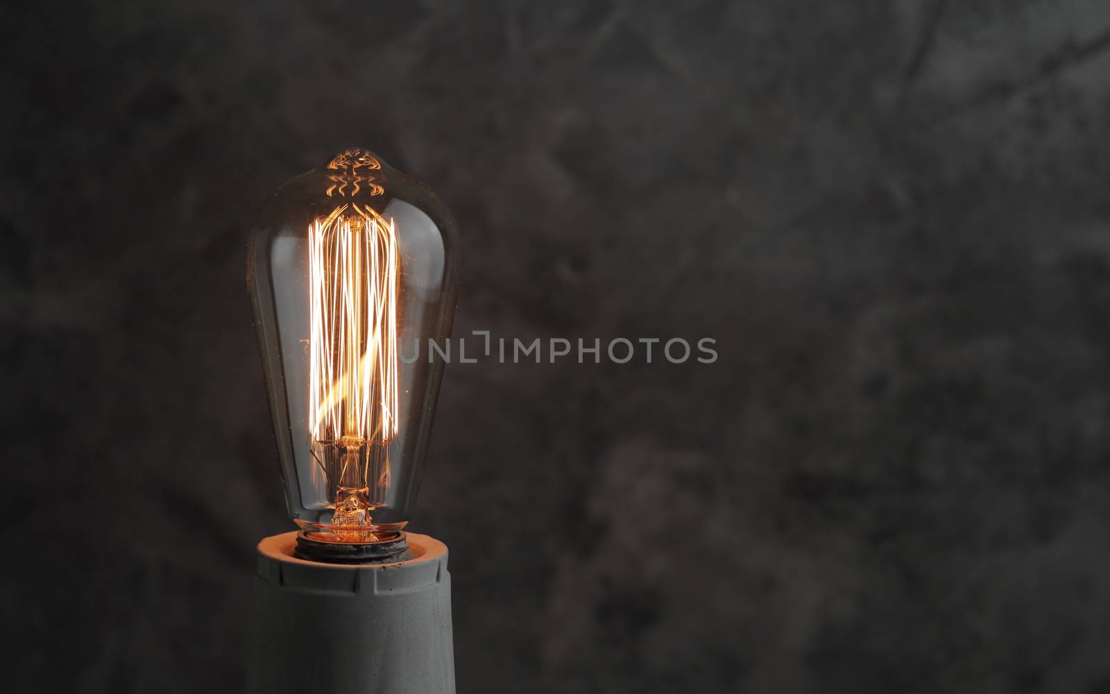 Retro lamp with Edison lamp on concrete. A good idea by selinsmo