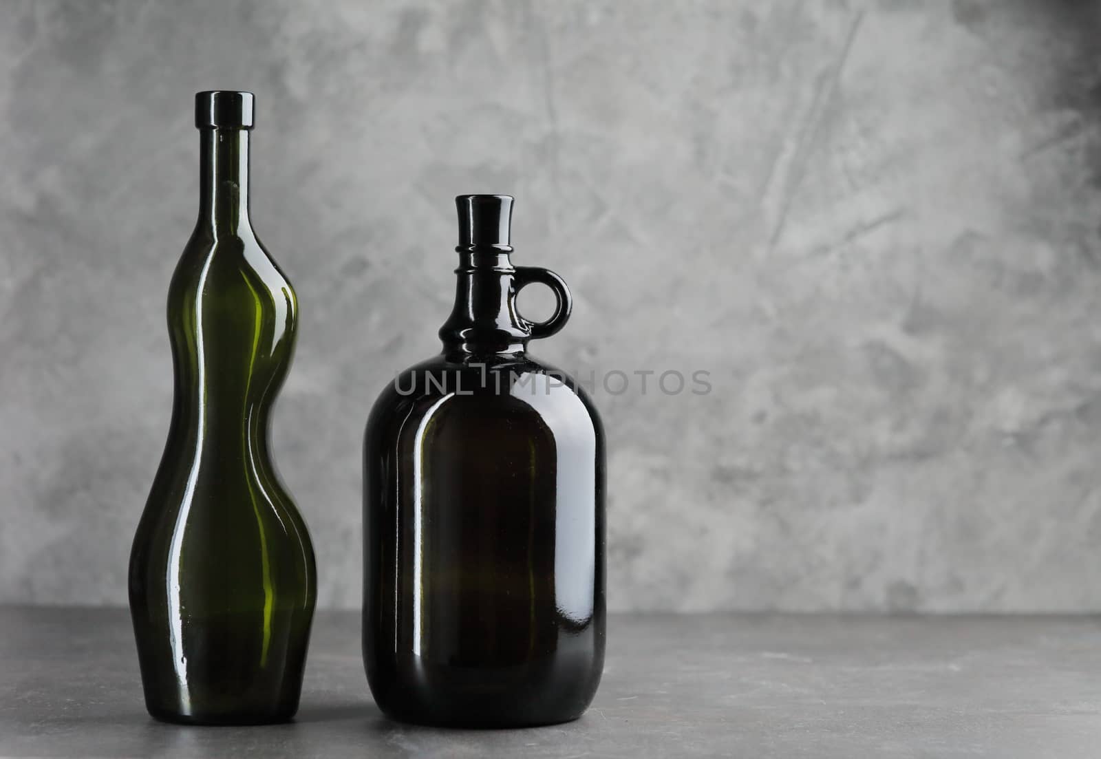 Wine bottle on a concrete background. Free space for inscription Fitness concept by selinsmo
