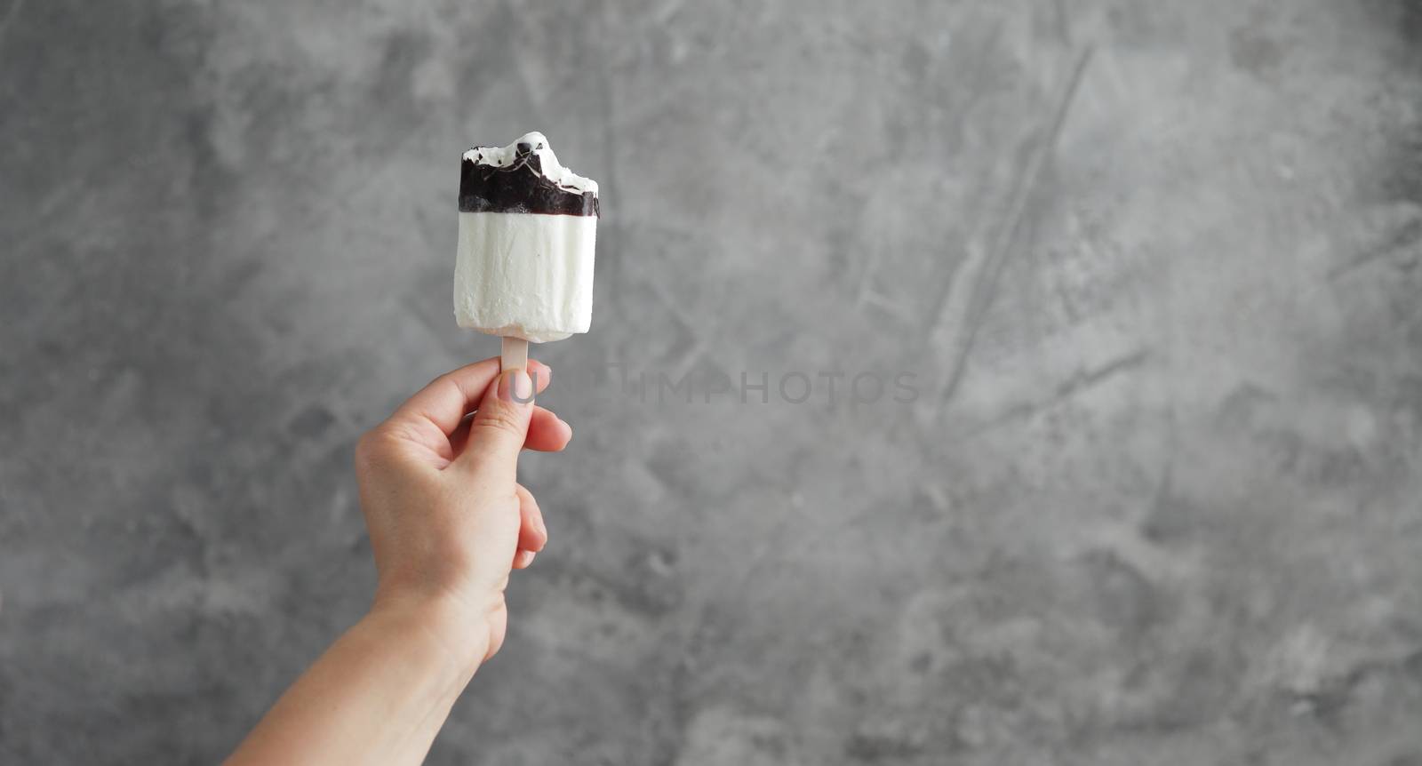 Ice cream in a female hand. Sweet dessert. High quality photo