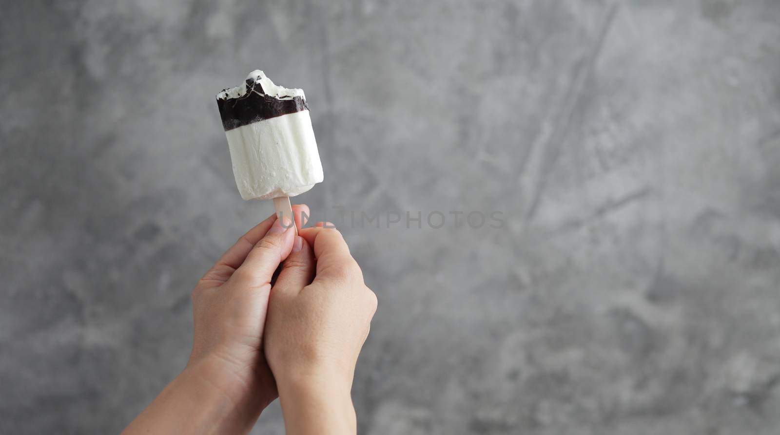 Ice cream in a female hand. Sweet dessert by selinsmo