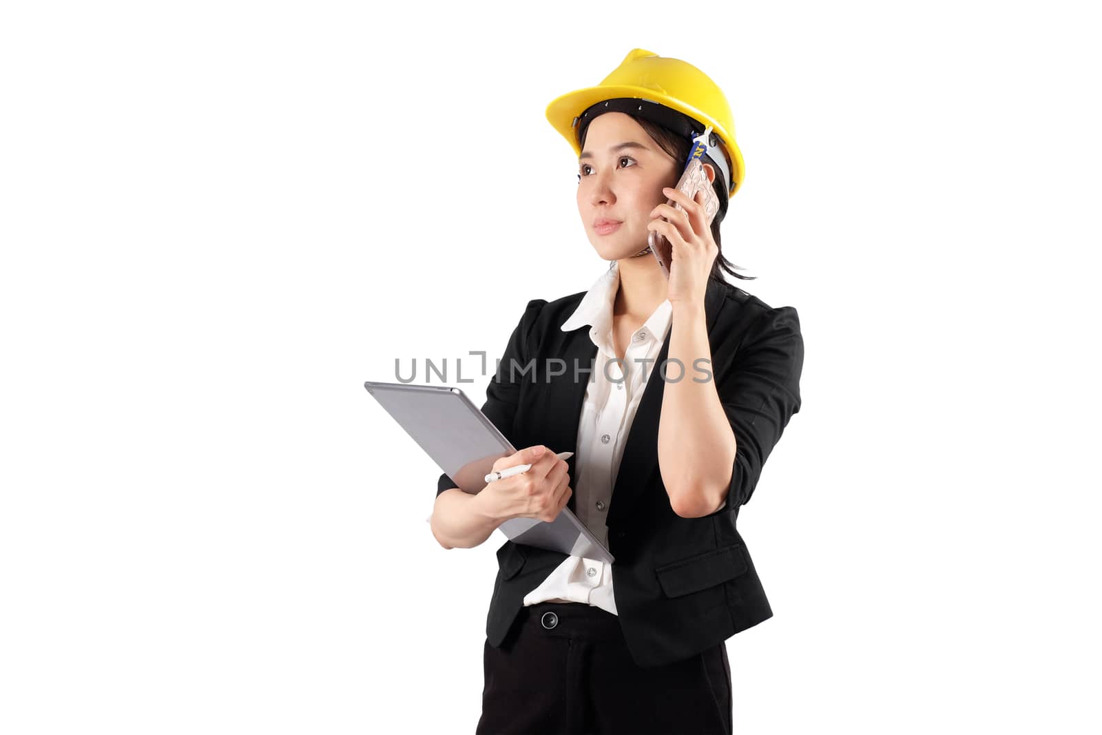 Young woman engineer holding digital tablet and using mobile phone isolated on white background