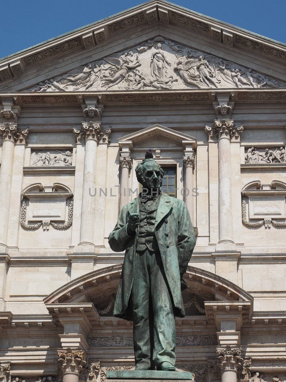 MILAN, ITALY - CIRCA APRIL 2018: Statue of writer Alessandro Manzoni in front of San Fedele church