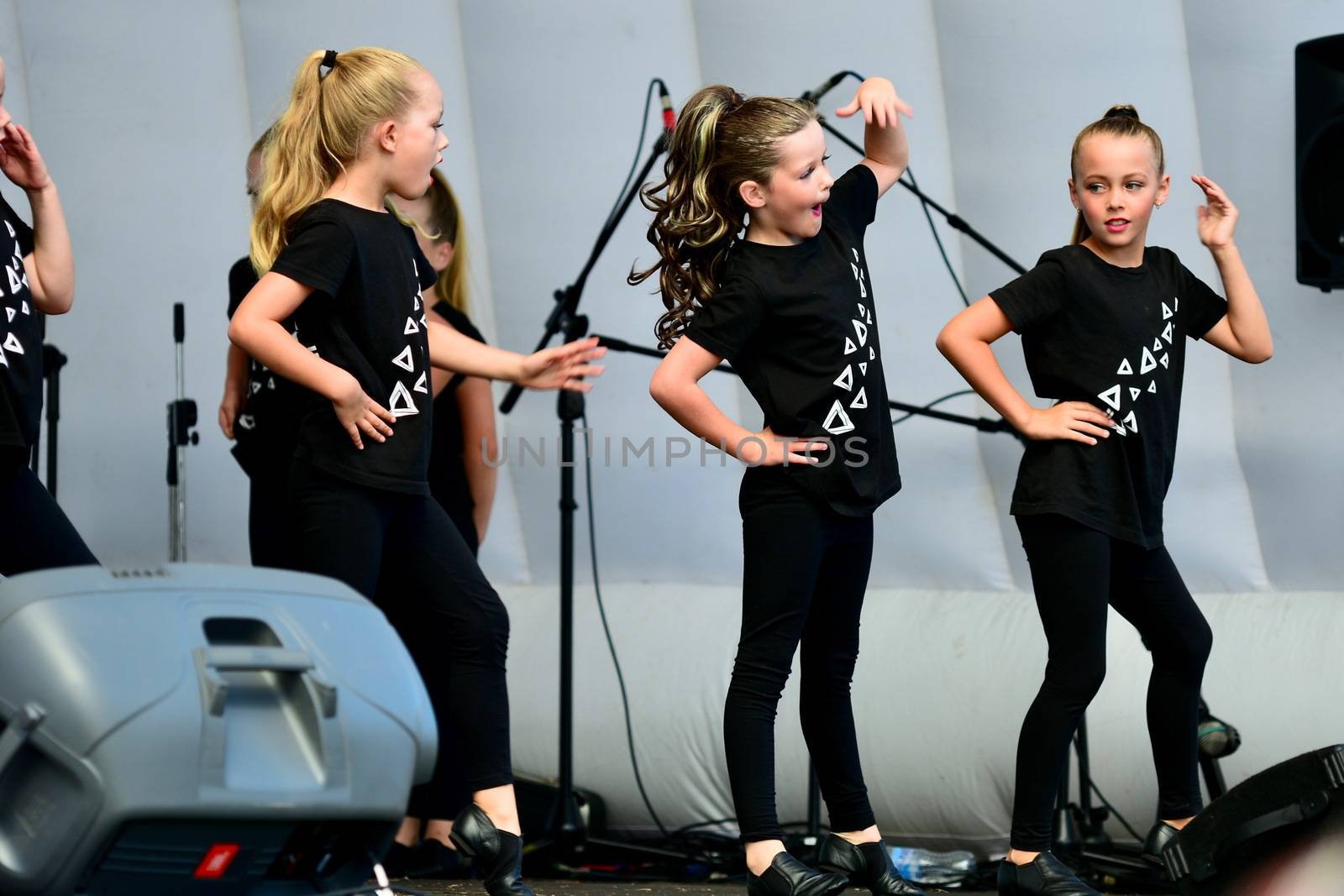 Auckland New Zealand - Mar 2020. Beautiful unidentified girls dancing at an outdoor stage in a public park. by Marshalkina