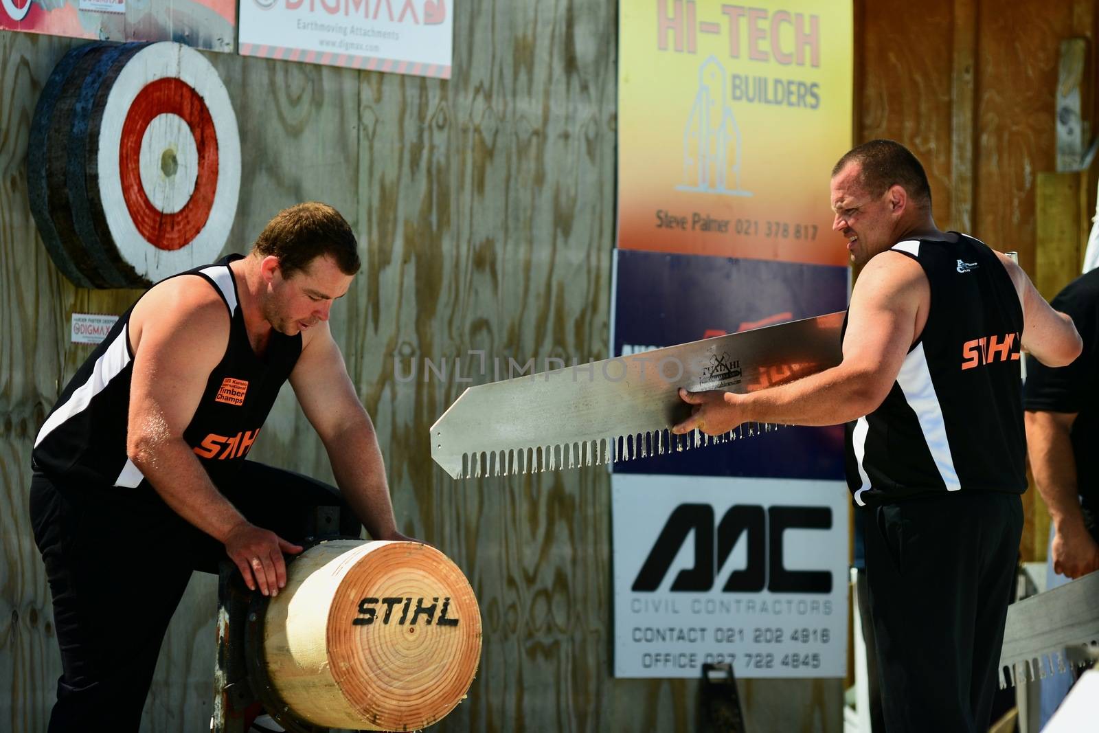 Kumeu, New Zealand - Mar 2020. 98th Annual Kumeu Show, International Timber Sports (the world Champion Axemen). Competition among renowned world axemen who came to New Zealand specifically for this event. by Marshalkina