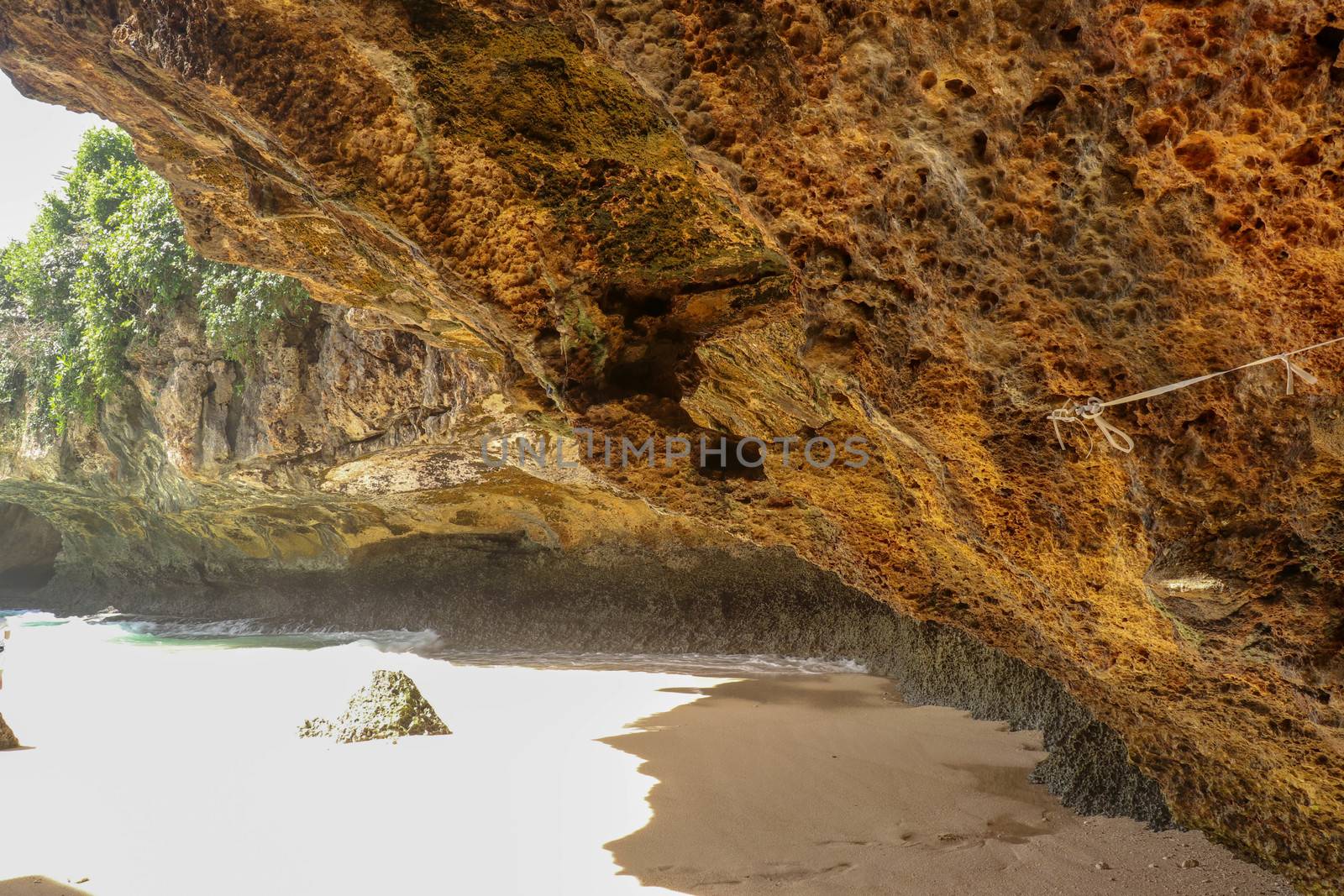 Suluban beach, Bali, Indonesia. Nature vacation background. Colorful sunrise on the rocky coast. Rocs on the beach. Blue ocean. Happy holiday. Vacation