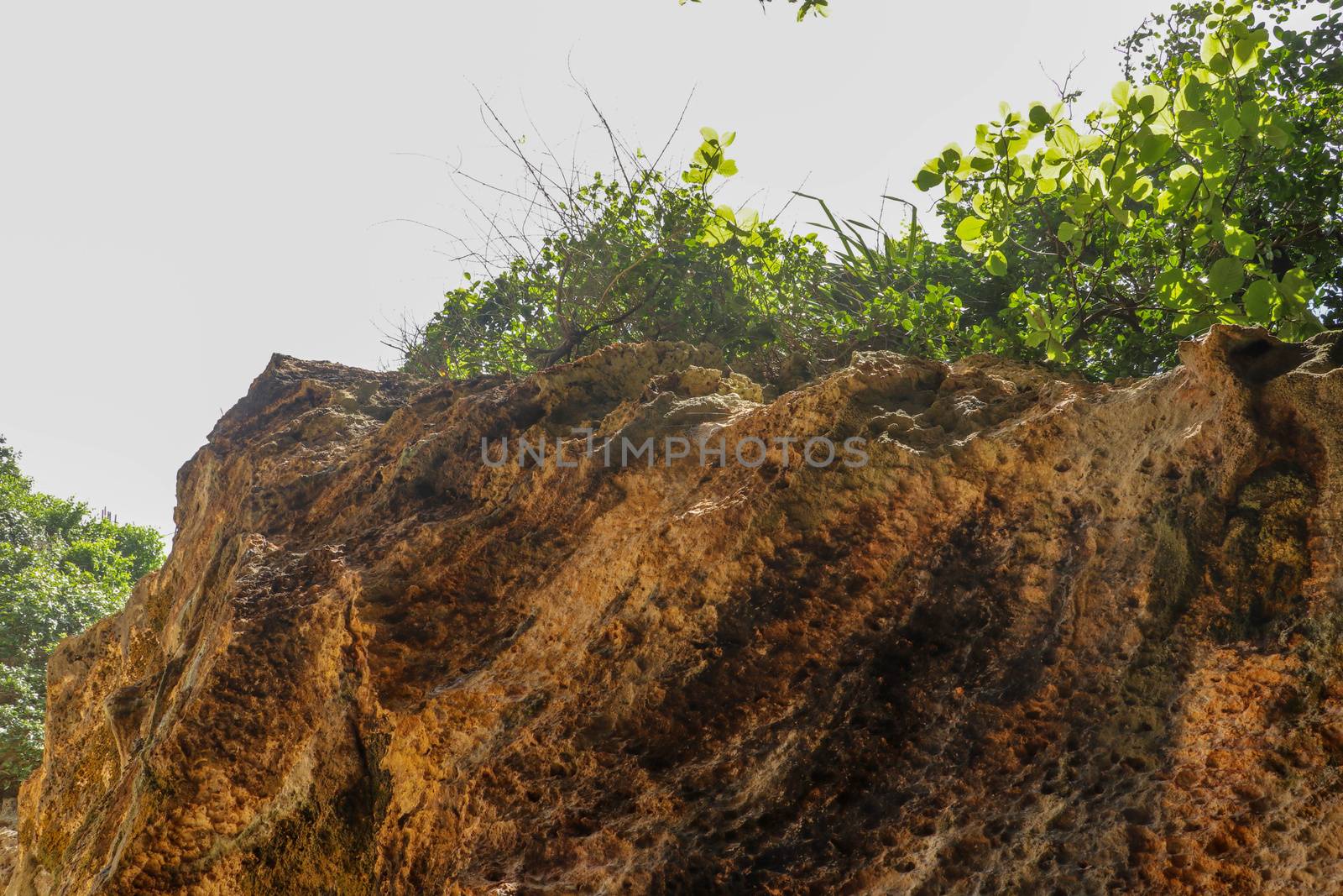 Suluban beach, Bali, Indonesia. Nature vacation background. Colorful sunrise on the rocky coast. Rocs on the beach. Blue ocean. Happy holiday. Vacation