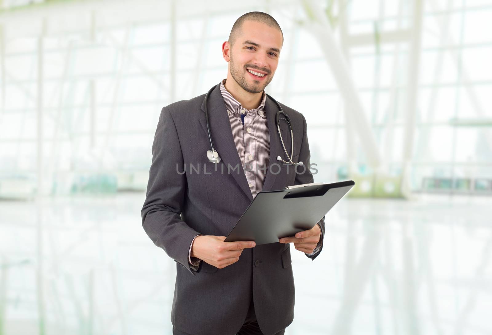 happy male doctor, at the hospital