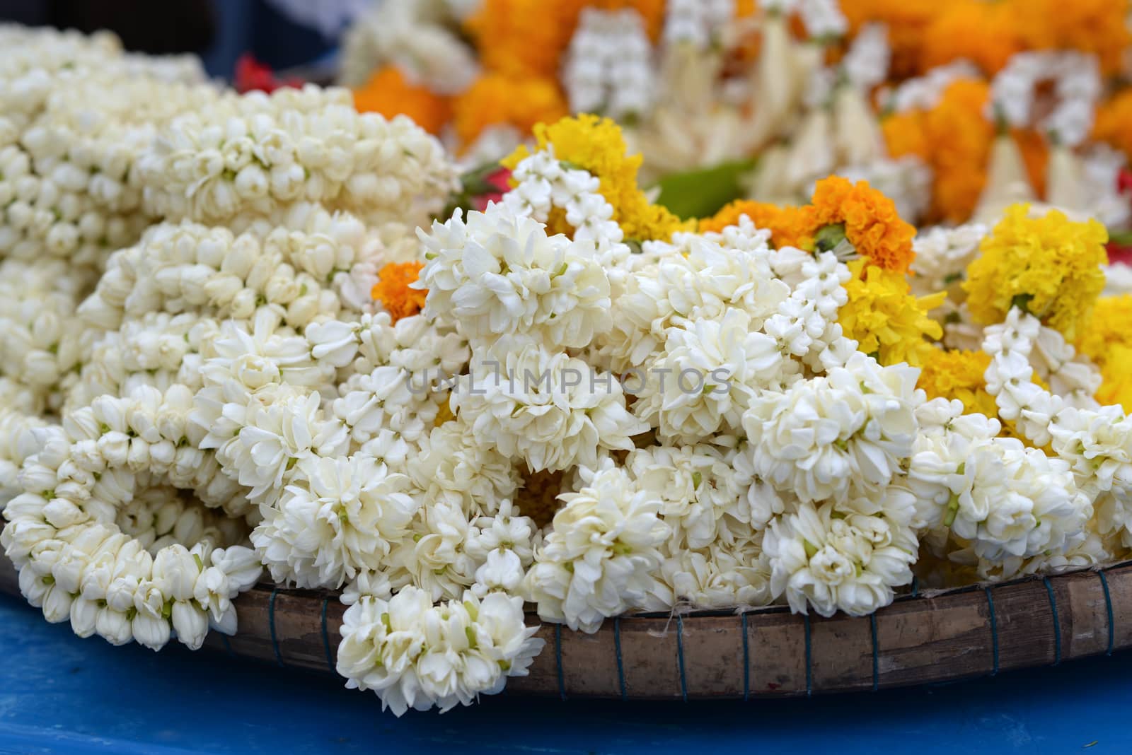 The garland is made of jasmine, dahlia, marigold on a pannier for a blurry background sale.