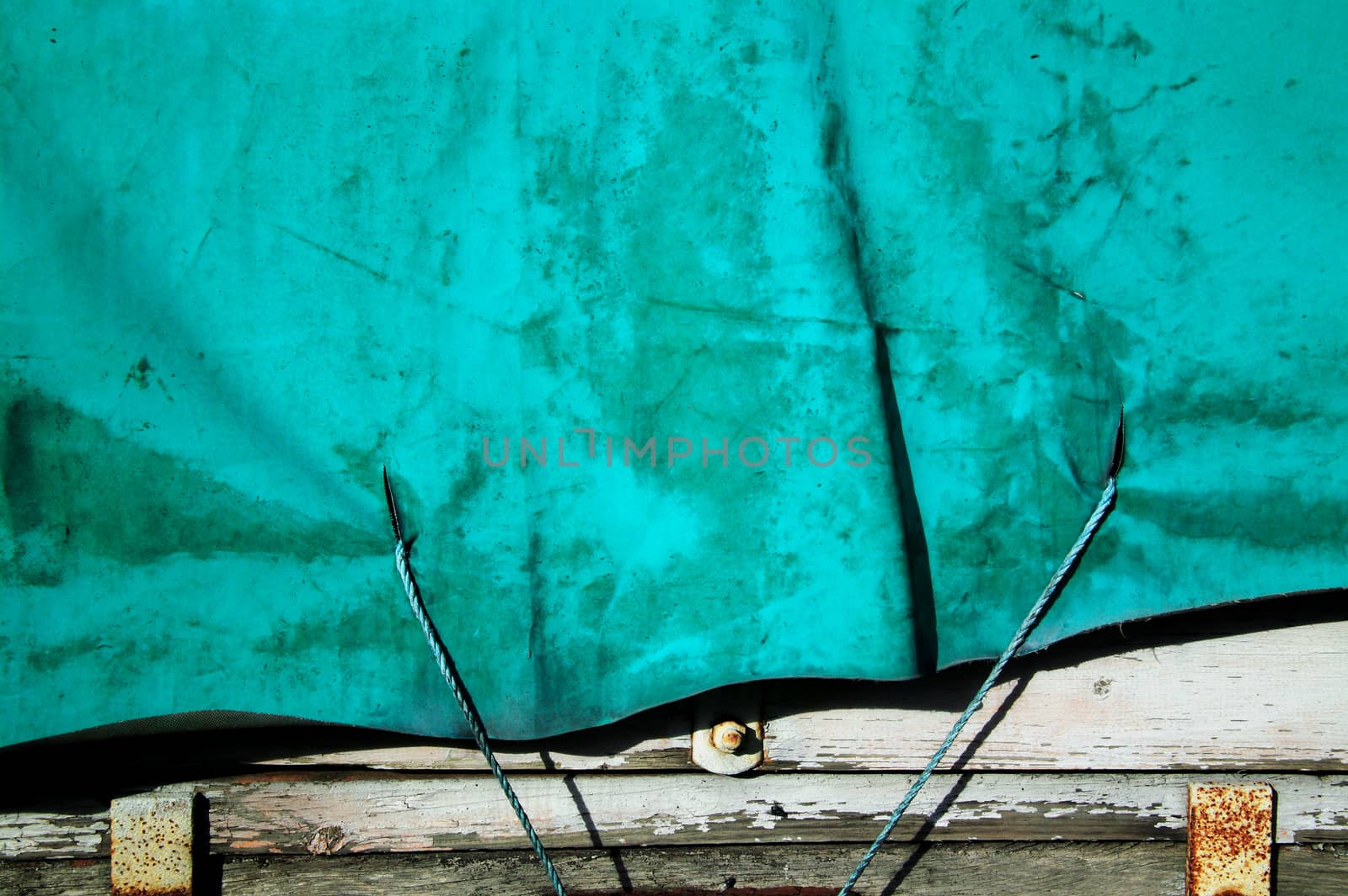 Old distressed, green canvas cover background  by ant