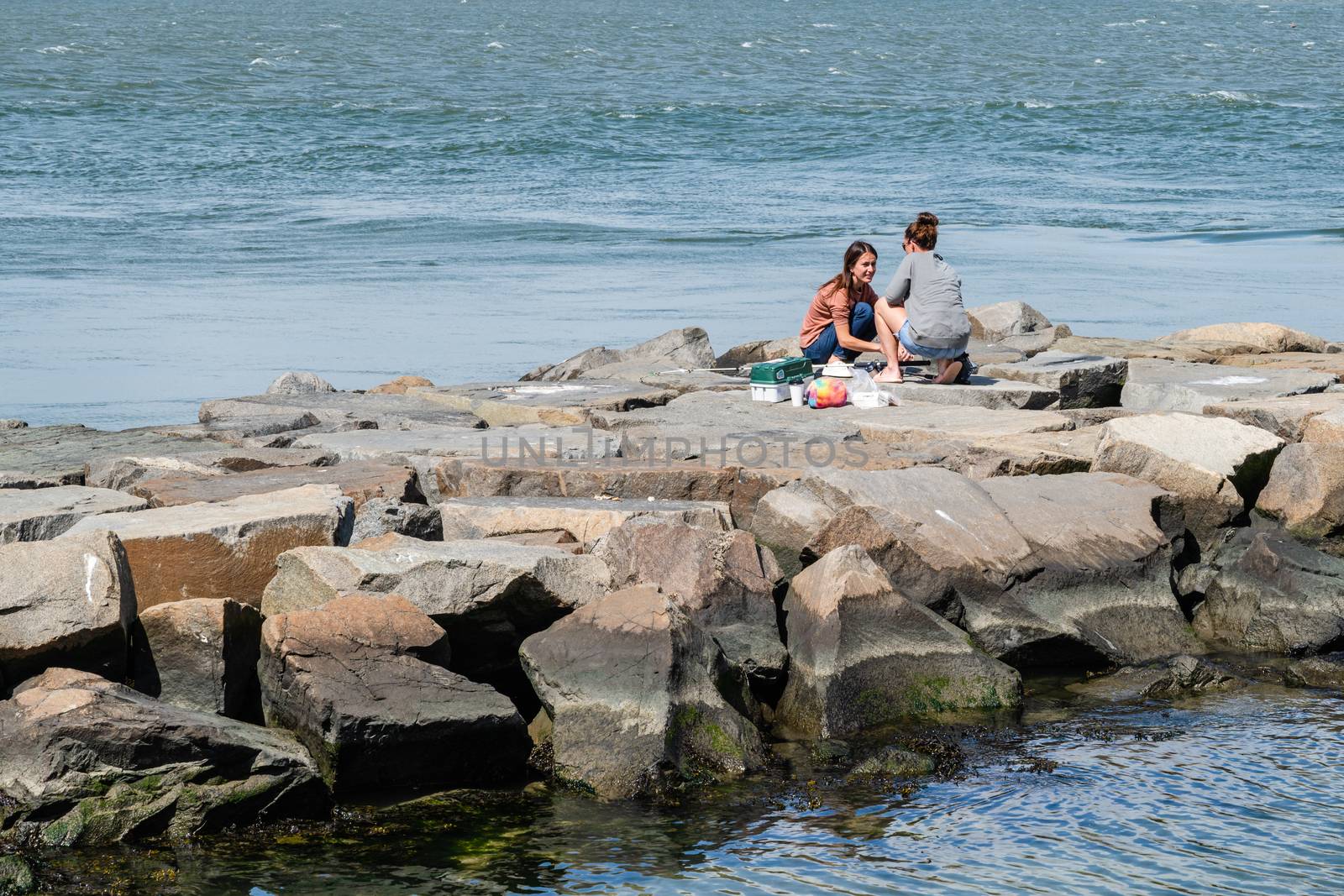 Young Women Fishing in Barnaget Bay by jfbenning