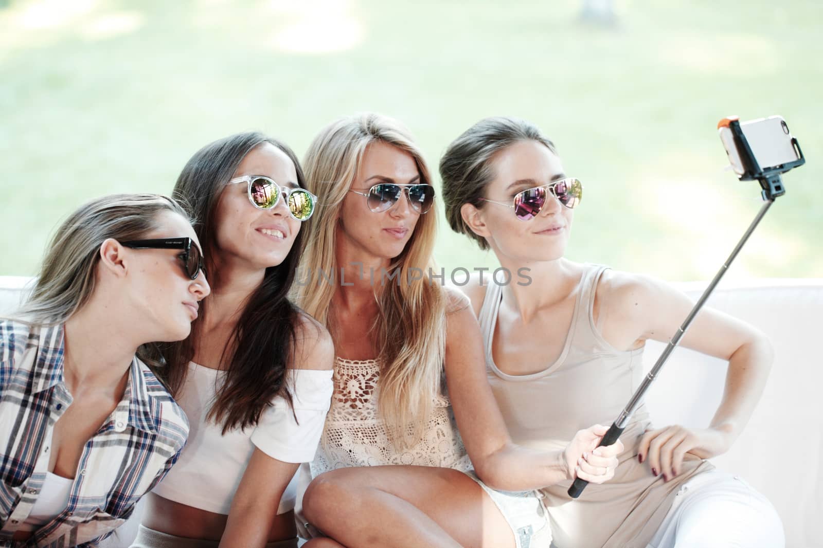 Girls with smartphone taking selfie by ALotOfPeople