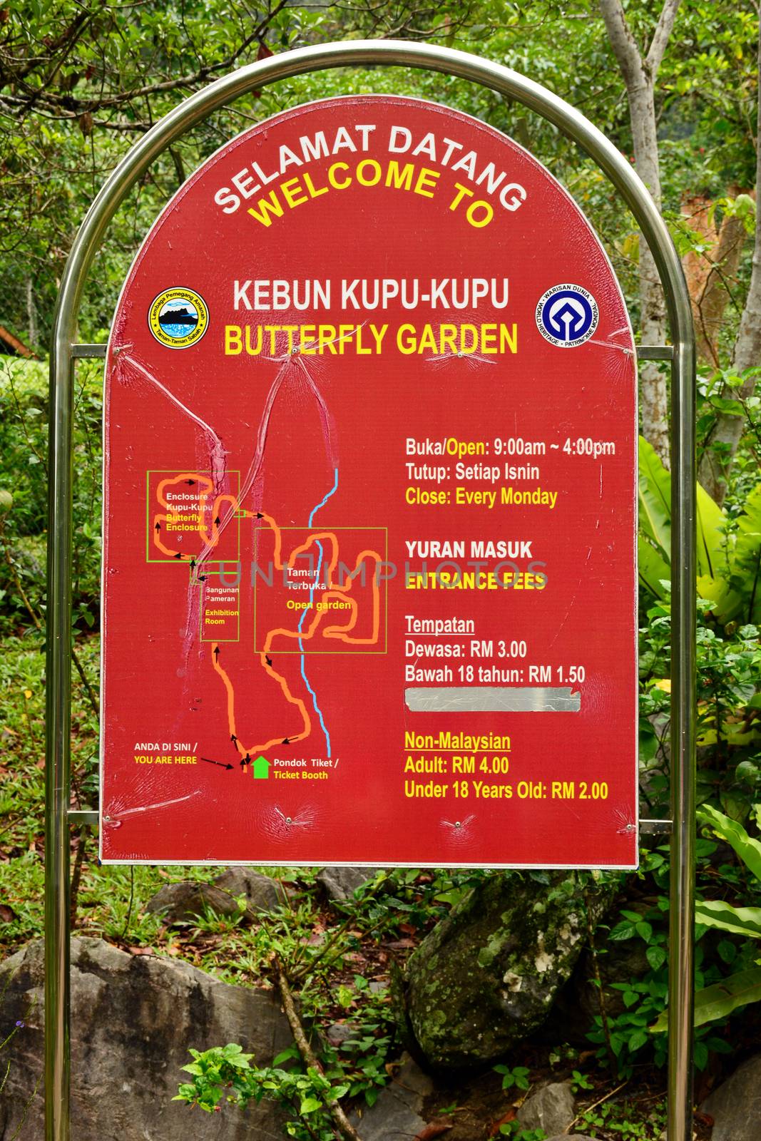 SABAH, MY - JUNE 18: Poring Hot Spring butterfly garden sign on June 18, 2016 in Sabah, Malaysia. Poring is situated in lowland rainforest, contrasting with the montane and submontane rainforest of Kinabalu National Park.