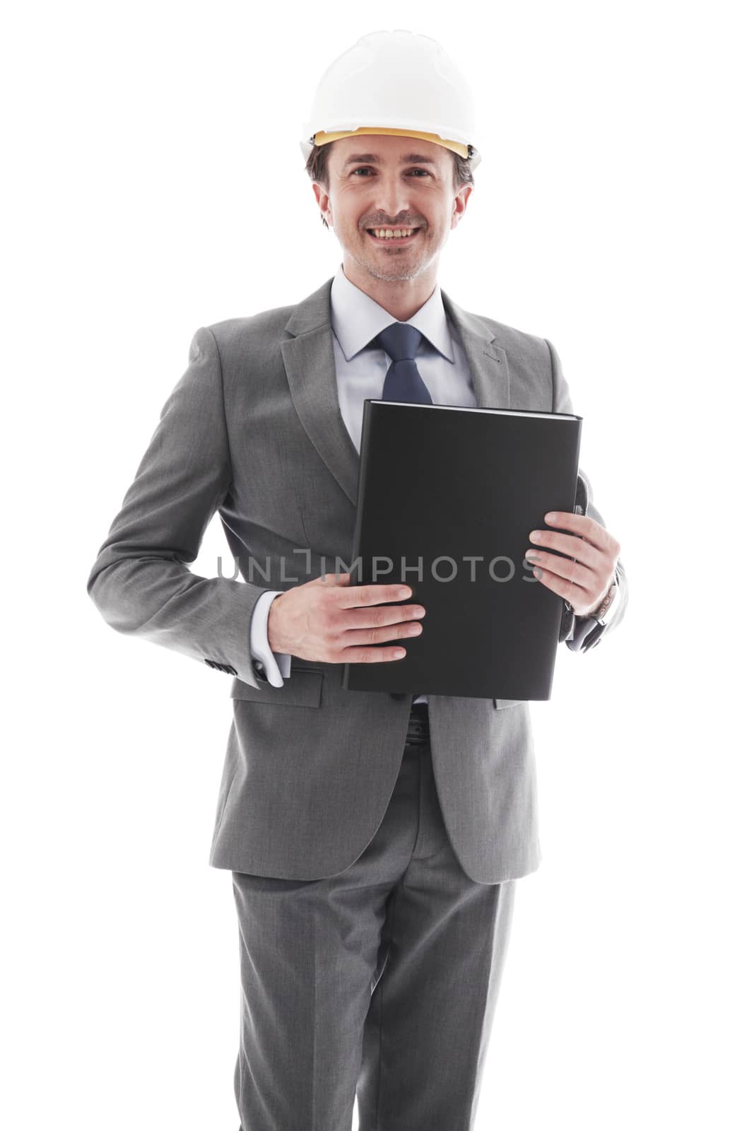 Young businessman in suit and construction hardhat isolated on white background