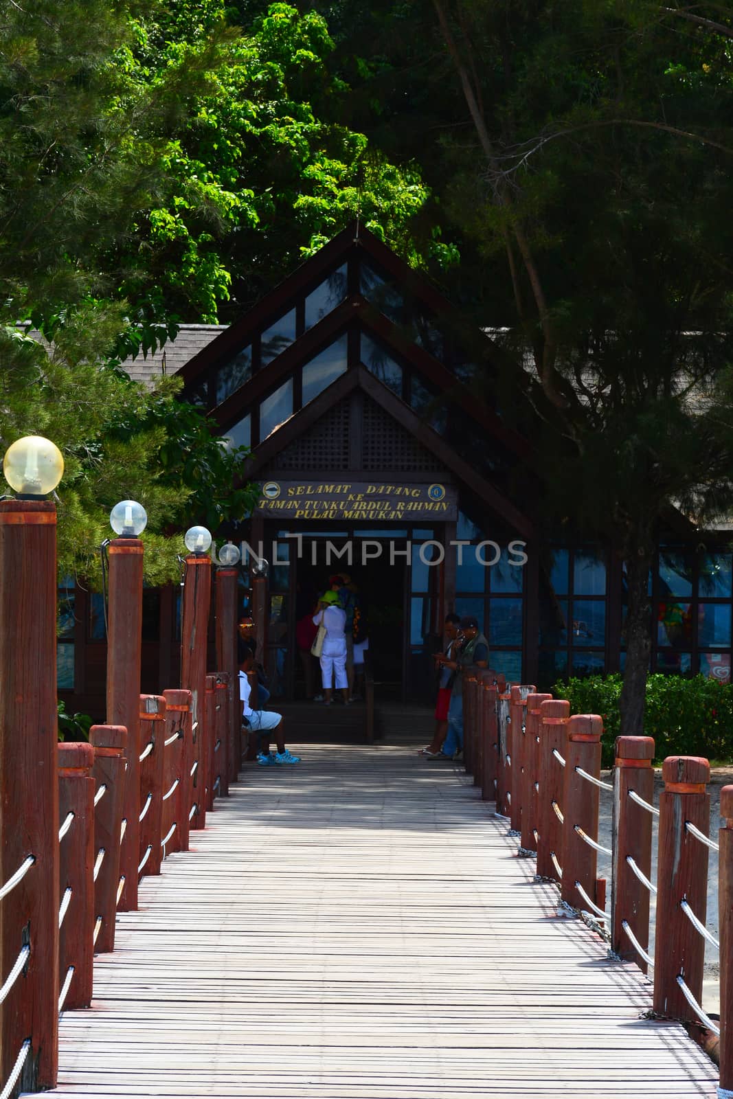 SABAH, MY - JUNE 20: Manukan Island footbridge on June 20, 2016 in Sabah, Malaysia. The Manukan Island Resort is a hideaway that is one of the five tropical islands that comprise the Tunku Abdul Rahman Park.